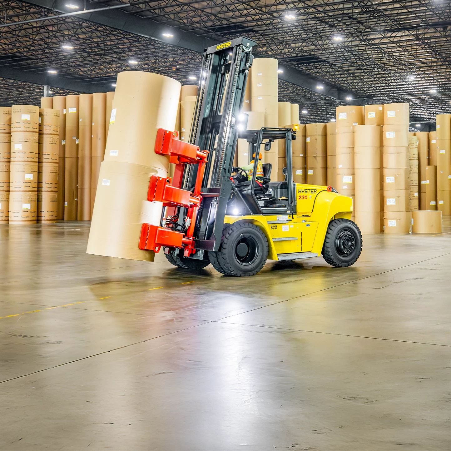 Hyster 230 lift truck with Auramo paper roll attachment.